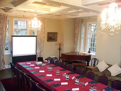 A boardroom-style meeting in the Rector's Drawing Room