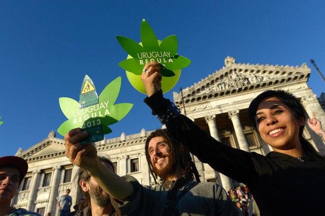 Activists celebrate the cannabis bill being passed in front of Congress in Uruguay