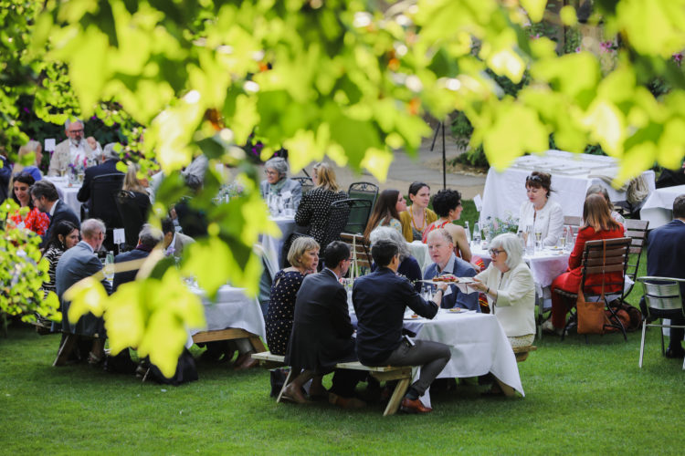 Guests enjoying the celebrations in the Fellows' Garden