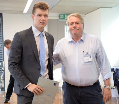 Andrew Heard is presented with the Shell Prize for Best Overall Performance in Fourth Year at Final Honours School by Glen Cayley