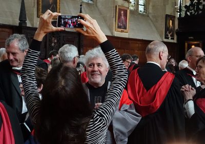 Pedro Almodóvar having a photo taken during the Benefaction