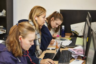 students studying at computers in the GCR