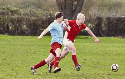 students playing football