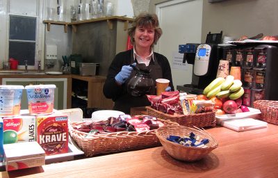 Carol from the catering team in the undercroft bar at breakfast