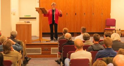 Professor Flieger addresses a large audience in the Saskatchewan Room
