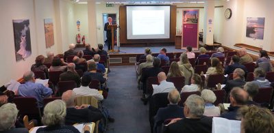 Rector Sir Rick Trainor welcomes guests to the War and Peace symposium