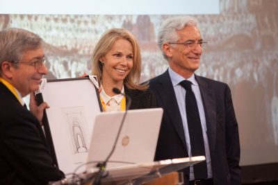 Rector Trainor presents Sir ronald Cohen with a gift