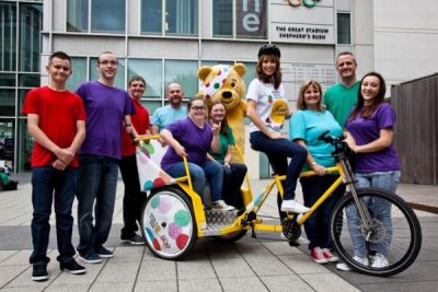 2013 The Rickshaw Challenge team with Alex Jones and Pudsey bear