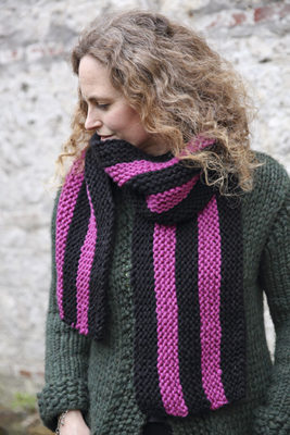 Christine wears her knitted Exeter College scarf.