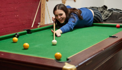 Students playing pool in the Undercroft