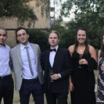 Exeter College Summer Programme Student smiling in Fellows Garden at a Formal