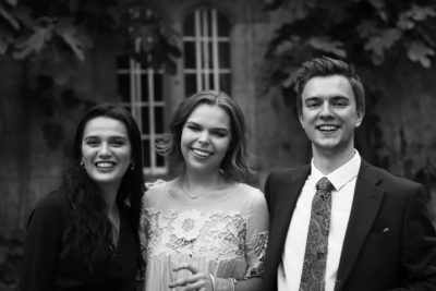 Exeter College Summer Programme Student smiling in Fellows Garden at a Formal