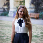 Exeter College student at a Formal smiling in the Front Quad