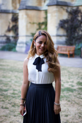 Exeter College student at a Formal smiling in the Front Quad