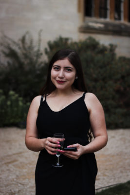 student at a formal in Front Quad smiling