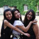 students smiling in Exeter College Front Quad