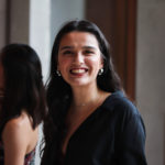 students at a formal smiling