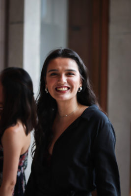 students at a formal smiling