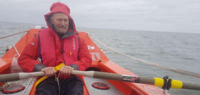 Richard Harries practices rowing on the open sea