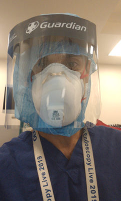 Aamir Saifuddin in full protective equipment during COVID pandemic