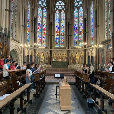 Exeter College choir rehearsing in the College chapel