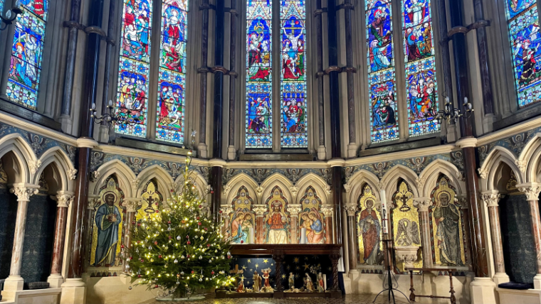 Exeter College Chapel looking festive with a christmas tree and nativity displayed at the altar