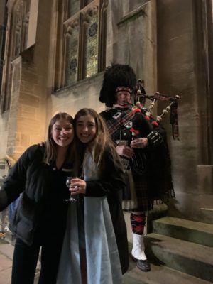 Exeter College Burns Night Dinner. Students with a piper outside the Dining Hall