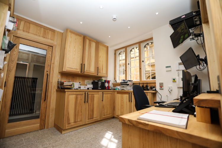 The refurbished Porters' Lodge main front desk, storage and electronic systems 