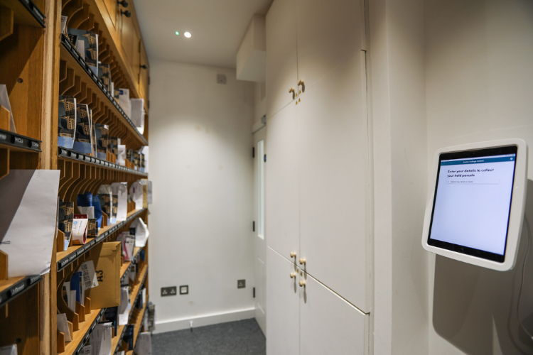 An iPad is mounted to the wall for users to easily collect held parcels stored in the back room from Staircase 2