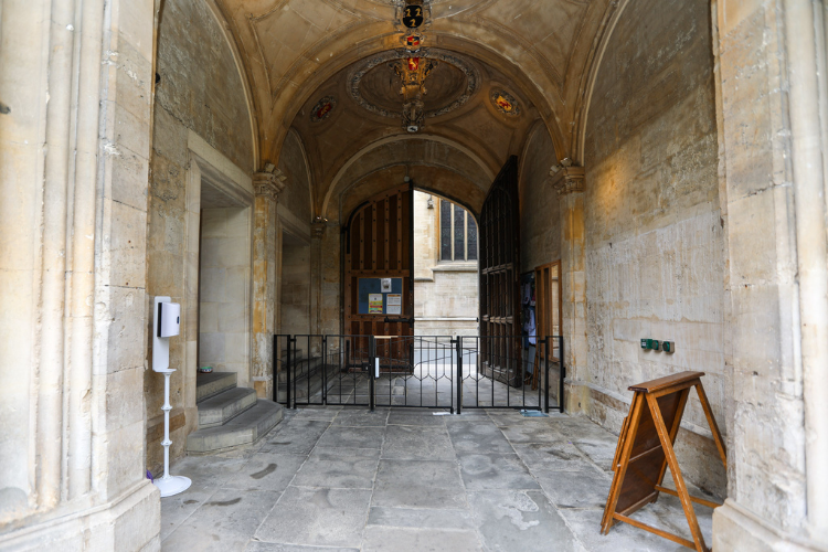 The secondary gates of the new Porters' Lodge facing towards Turl Street with the wooden gate half open 