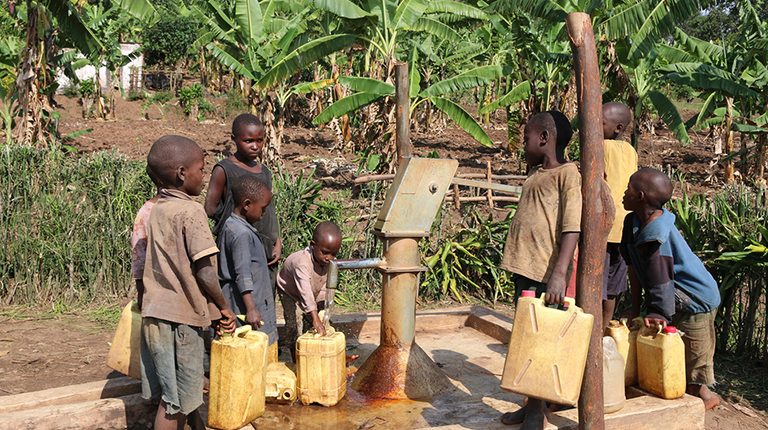 Children getting fresh drinking water in Rwanda