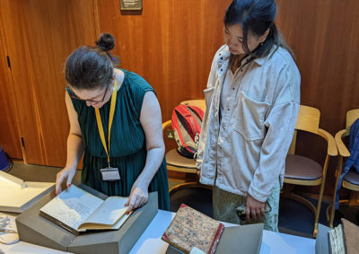 People looking at archive materials