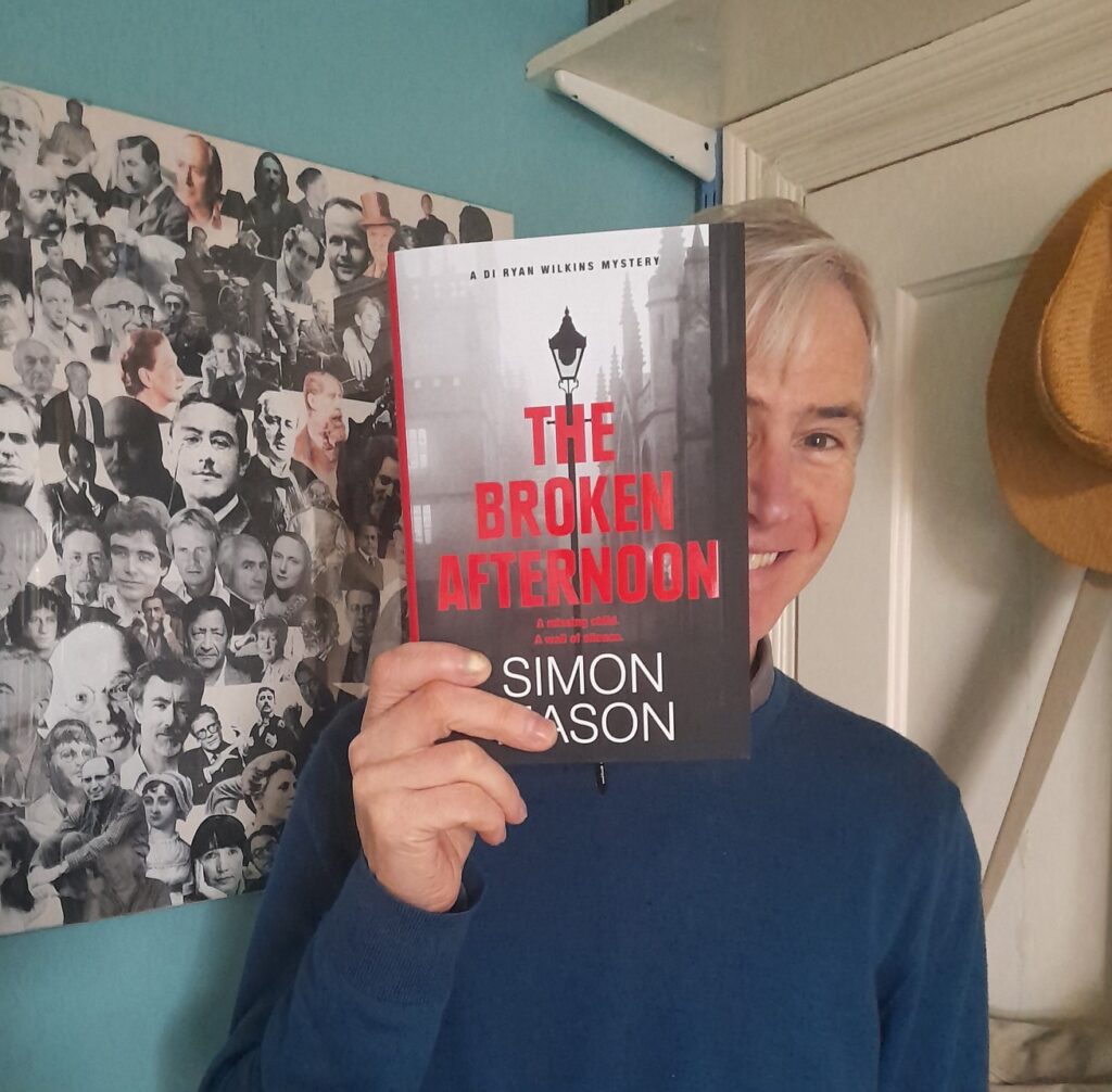 Simon Mason with his book The Broken Afternoon