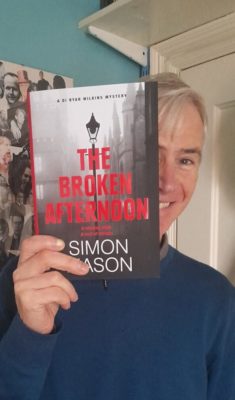 Simon Mason with his book The Broken Afternoon