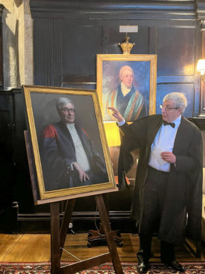 Rector Rick Trainor with his portrait