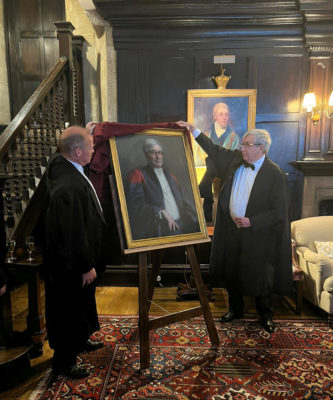 Rector Rick Trainor and Bursar Nicholas Badman unveiling the portrait of Rick Trainor