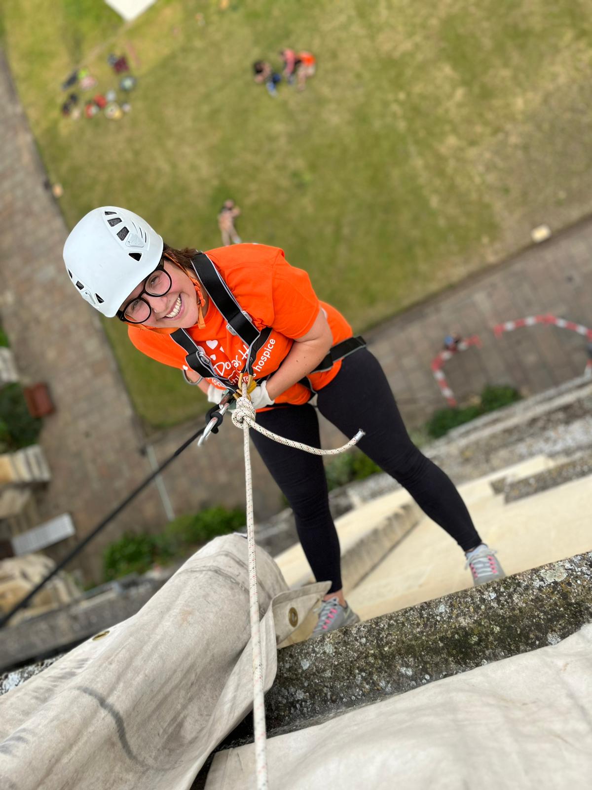 Liv Ace abseiling down Exeter College Lodge Tower