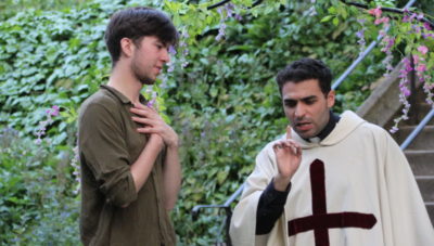 Two students acting in The Mandrake in the Fellows' Garden
