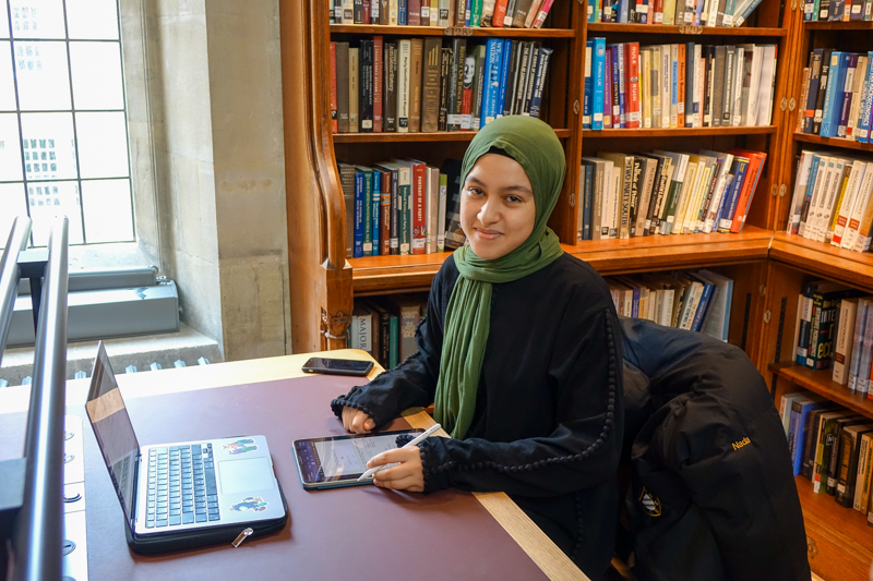 Student using refurbished Exeter College Library