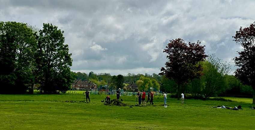 Students preparing a wild flower meadow at the College sports ground