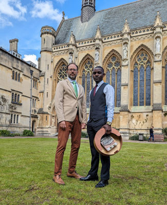 Delvyn Case and John Pfumojena in front of Exeter College, Chapel.