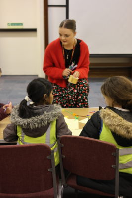 Reanna Bowen with students from John Henry Newman Primary School