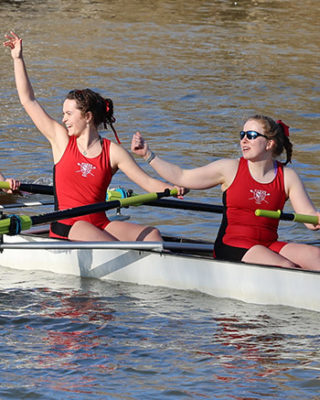 Exeter's rowers celebrate a bump over Teddy Hall