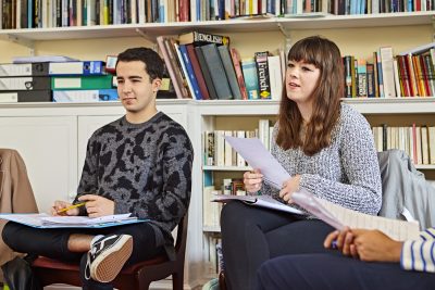 students in a tutorial with Jane Hiddleston