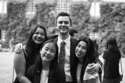 students at a formal in Front Quad smiling