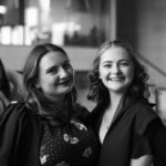 students smiling at formal