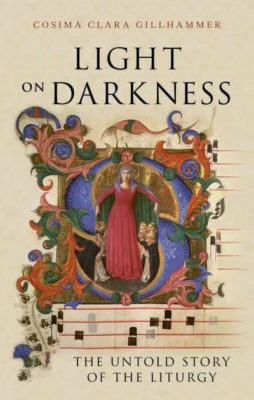 Book cover for Light on Darkness by Cosima Clara Gillhammer. The background is a warm, parchment-like beige. The title appears in large serif text at the top. In the centre is an ornate, medieval-style illuminated illustration: a robed figure in red stands with arms slightly outstretched inside a decorative circular frame, surrounded by intricate floral and scrollwork patterns in blues, reds, and golds. Smaller figures appear beneath the central figure, adding a religious or liturgical feel. To the right, faint musical notation lines and notes run vertically. At the bottom, the subtitle reads: “The Untold Story of the Liturgy.”