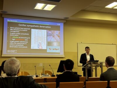 Dr Ben Bussmann presents his award-winning research on cardiac sympathetic denervation at the ISAN 2026 meeting in Bologna, showing a slide about using image-guided radiotherapy to target cardiac nerves as a potential treatment for ventricular arrhythmias.